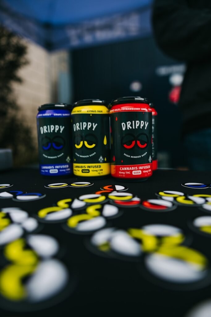 a table topped with three cans of drink