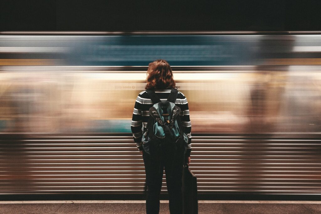 person standing in front of train station