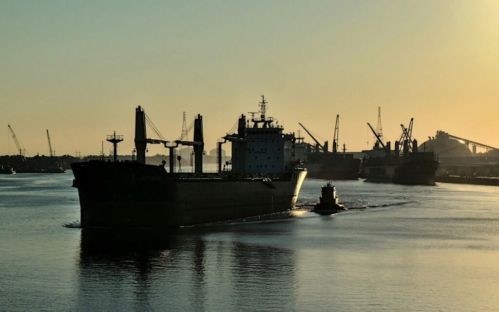 A large boat floating on top of a body of water
